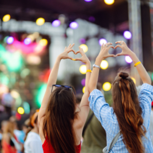 two girls making heart hands